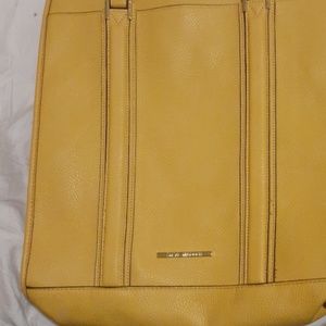 A yellow Steve madden purse